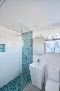 a bathroom with a toilet and a glass shower at Waterfront Cabana 5 Key Largo in Key Largo +31 photos