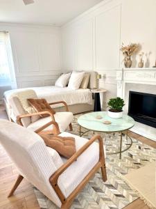 a living room with a couch and a table at La Folie Blanche in Vertou