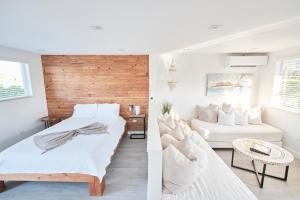 a bedroom with two beds and a living room at Waterfront Cabana 5 Key Largo in Key Largo