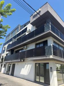 an apartment building with solar panels on it at Risa Apartments in Oradea
