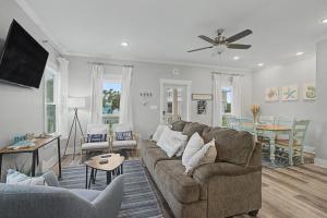 a living room with a couch and a table at 3BD Beach House by Next Step Property Management in Long Beach