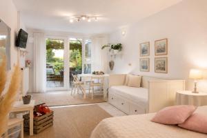 a bedroom with a bed and a desk and a table at Apartments Ladka in Begunje na Gorenjskem