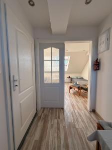 an open door to a room with a bed at Apartmán Bílé Karpaty in Strání