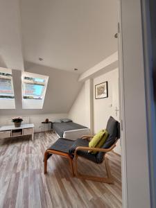 a living room with a couch and a bed at Apartmán Bílé Karpaty in Strání