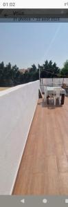 a view from the roof of a building with a table at Jolie Villa à Sahloul in Sousse
