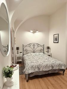 a bedroom with a bed and two night stands at Center feelings studio by Alandala in Cluj-Napoca
