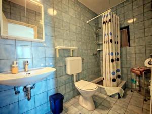 a bathroom with a sink and a toilet and a shower at Room`s Brica in Barbat na Rabu +34 photos