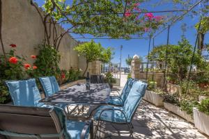 a table and chairs sitting on a patio at Apartment Amfora in Podgora +29 photos