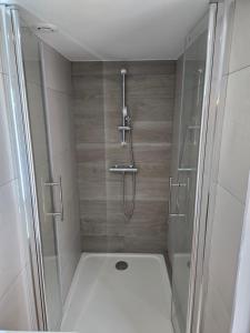 a bathroom with a shower and a toilet at small and cozy in Perpignan
