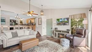 a living room with a couch and a fireplace at Honey Hole 3 Well Dock in Camdenton