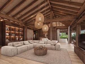 a living room with a couch and a tv at The Kontiki in Willemstad