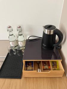 a coffee maker sitting on top of a table at Kamea in Poznań