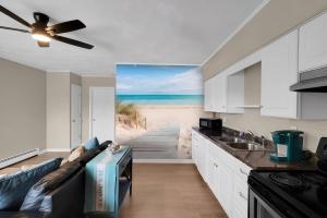 a kitchen with a couch and a view of the beach at Between Tides 2BR Walk to Beach Unit B in Seaside Park