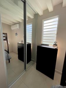 a bathroom with a glass shower and a sink at Modern 4BR Oasis in Bayamón +31 photos