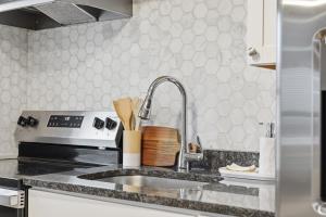 a kitchen with a sink and a stove at Cozy Corner in East Stroudsburg