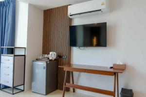 a room with a desk and a small refrigerator at PGD Blue city view in Rawai Beach