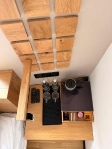 a bed room with a desk in a room at Kamea in Poznań