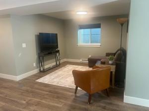a living room with a couch and a television at Thirty-Six Street Retreat in Missoula