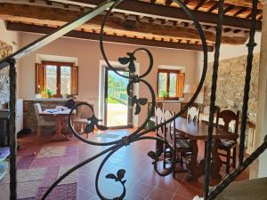 a view of the dining room and living room of a house at B&B Toringo in Capannori +19 photos