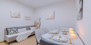 a dining room with a table and a couch at Uffice apartment in Shanghai