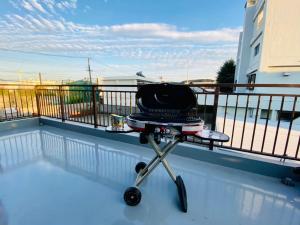 a grill on a table on a balcony at AZ HOTEL - Vacation STAY 56046v in Sumoto
