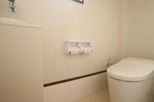 a bathroom with a toilet and two rolls of toilet paper at AZ HOTEL - Vacation STAY 56046v in Sumoto +4 photos