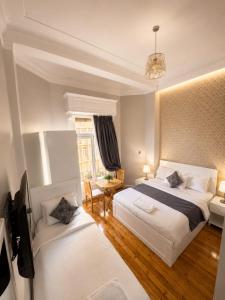 a hotel room with two beds and a television at new colmbia in Cairo