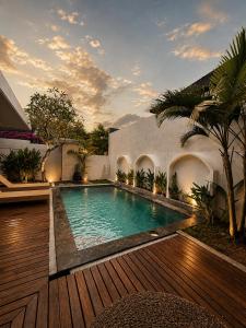 a swimming pool in the backyard of a house at Asania Villa in Uluwatu