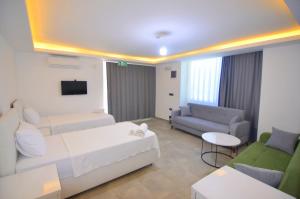 a large living room with a couch at Fethiye Cagri Pansiyon in Fethiye