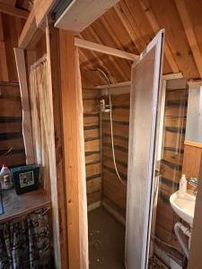 a bathroom with a shower and a sink at Järvenukka Puhkemaja in Ähijärve