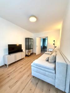 a bedroom with a bed and a flat screen tv at Mountain Nest Apartment in Schottwien