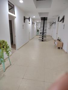 an empty hallway with stairs in a building at Hotel santa Rosa 2 in Ovalle