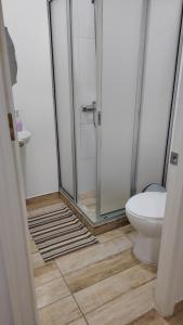 a bathroom with a shower and a toilet at Hotel santa Rosa 2 in Ovalle