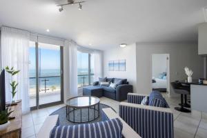a living room with a view of the ocean at Hibernian Towers 408 in Strand