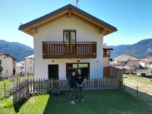 two women standing in front of a house at La Gemma Bed & Breakfast in Montesover