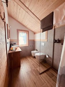 a bathroom with a shower and a toilet and a sink at La Gemma Bed & Breakfast in Montesover +153 photos
