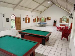 a pool room with two ping pong tables at Touristic House Chalet Luna Verde in Sasaima +89 photos
