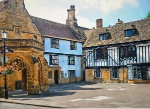 a group of buildings in a town with a street at The Rest-Well Lodge in Sherborne