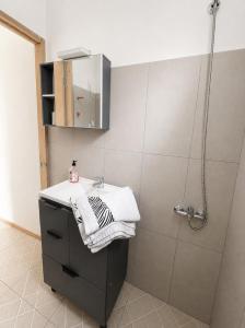 a bathroom with a sink and a shower at Alojamiento EYO en Chuy con Baño Privado y Aire Acondicionado in Chuy +12 photos