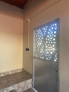 a bathroom with a shower with a metal door at Jean Pierre in La Merced