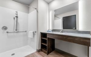 a bathroom with a sink and a mirror at My Place Hotel-Jonesboro, AR in Jonesboro