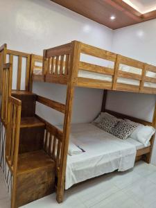 a bedroom with two bunk beds in a room at Silid in Legazpi