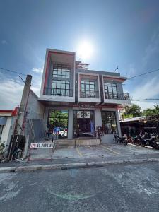a building with a no parking sign in front of it at Silid in Legazpi
