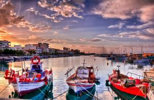 a group of boats docked in a harbor at sunset at Modern flat in town center! in Kiaton