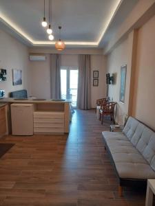 a living room with a couch and a table at Modern flat in town center! in Kiaton