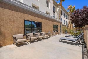 a row of chairs sitting next to a building at Hampton Inn & Suites Lancaster in Lancaster