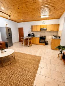 a large room with a kitchen and a table at CAVE Properties Group in Pionierspark