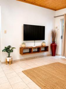 a living room with a flat screen tv on a wall at CAVE Properties Group in Pionierspark