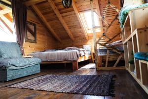 a room with a bed and a couch in a cabin at Kraljica Radoinja in Kokin Brod +49 photos