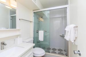 a bathroom with a shower and a toilet at Ilikai Marina 1285 in Honolulu +13 photos
